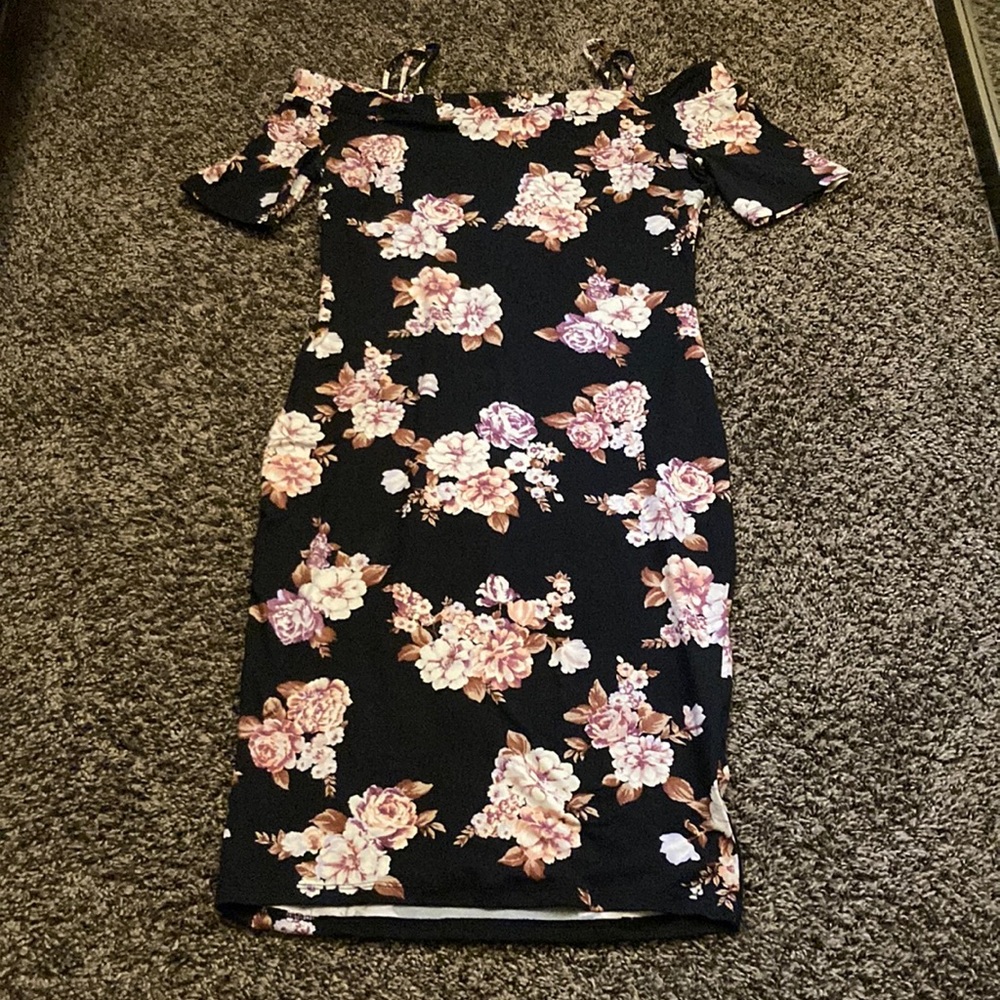 The dress is black with flowers. The brand is called Haute Monde. It is a large.